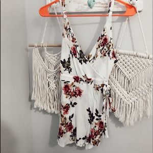 White v-neck romper with flowers size small